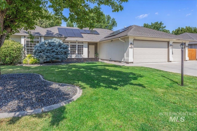 4975 N Morninggale Way, Boise, ID 83713 - ranch-style home featuring a garage, a front lawn, roof mounted solar panels, driveway, and stucco siding