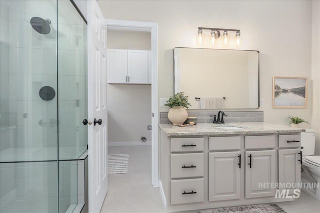 4975 N Morninggale Way, Boise, ID 83713 - bathroom with a shower stall, tile patterned flooring, and vanity