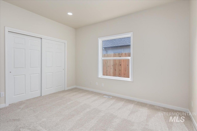 4975 N Morninggale Way, Boise, ID 83713 - unfurnished bedroom with carpet flooring, a closet, and recessed lighting