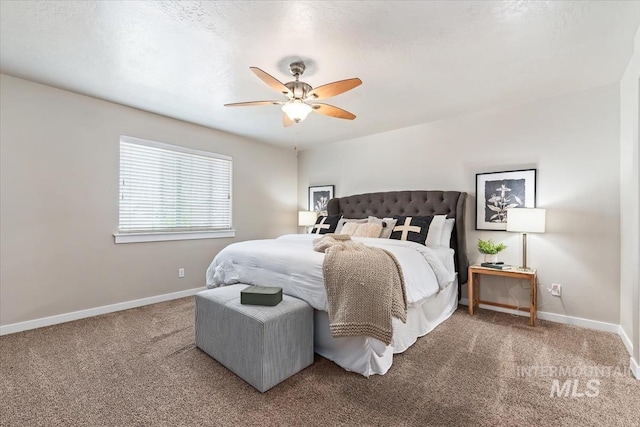 carpeted bedroom with baseboards and a ceiling fan