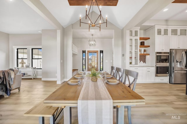1580 Clear Creek Loop, Twin Falls, ID 83301 - dining room featuring a chandelier, light wood finished floors, lofted ceiling, and baseboards