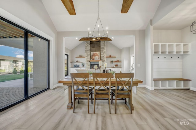 1580 Clear Creek Loop, Twin Falls, ID 83301 - dining room with light wood-style floors, baseboards, and a stone fireplace