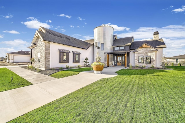 1580 Clear Creek Loop, Twin Falls, ID 83301 - view of front of house with stone siding, a chimney, and a front lawn