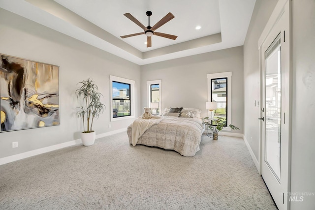 1580 Clear Creek Loop, Twin Falls, ID 83301 - bedroom with baseboards, carpet flooring, a tray ceiling, and a ceiling fan