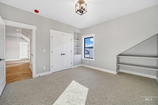 1580 Clear Creek Loop, Twin Falls, ID 83301 - unfurnished bedroom with baseboards, a closet, recessed lighting, a chandelier, and carpet flooring