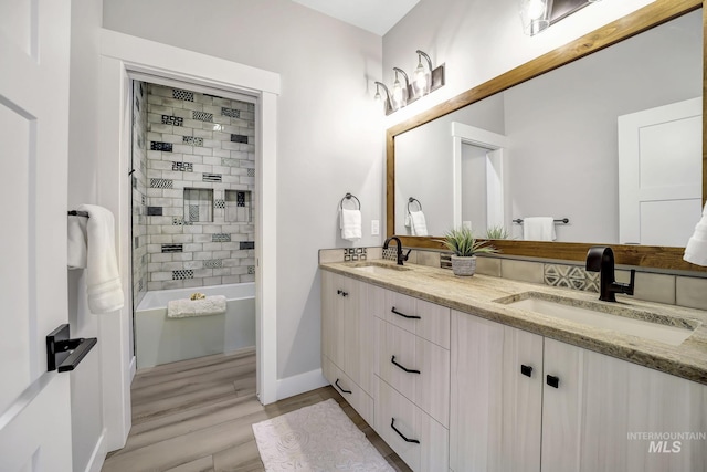 1580 Clear Creek Loop, Twin Falls, ID 83301 - bathroom featuring wood finished floors, double vanity, baseboards, and  shower combination