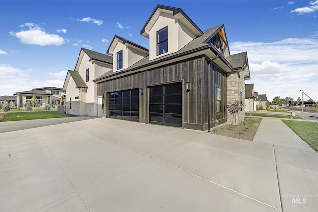 1580 Clear Creek Loop, Twin Falls, ID 83301 - view of home's exterior with a garage, driveway, a residential view, roof with shingles, and central AC