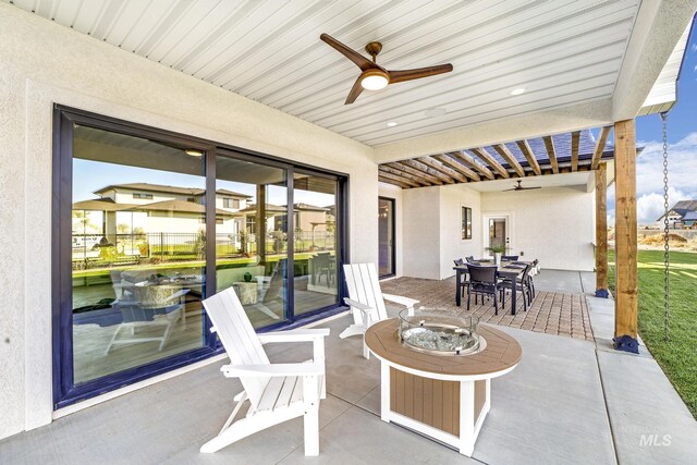 1580 Clear Creek Loop, Twin Falls, ID 83301 - view of patio / terrace featuring a ceiling fan, outdoor dining space, and an outdoor fire pit