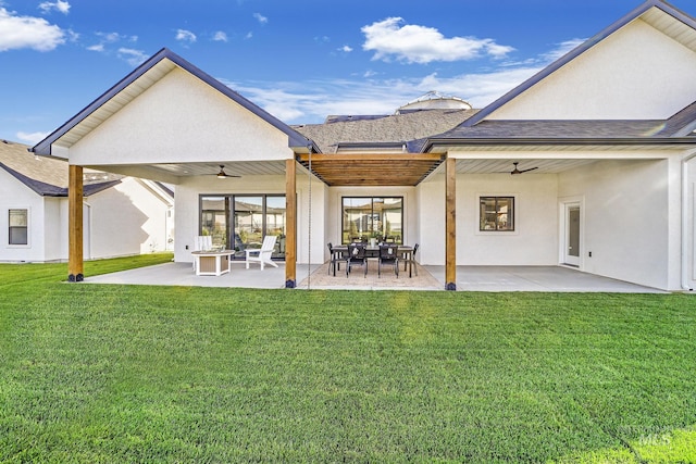 1580 Clear Creek Loop, Twin Falls, ID 83301 - rear view of house with ceiling fan, stucco siding, a yard, and a patio
