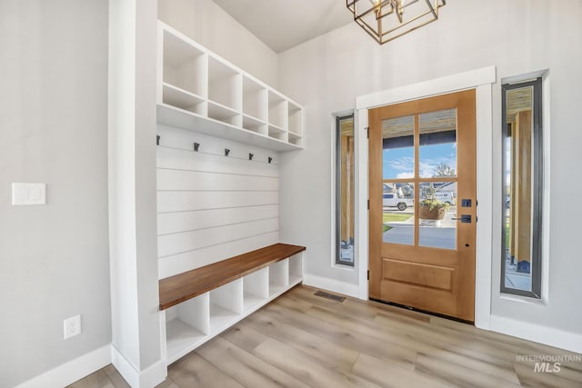 1580 Clear Creek Loop, Twin Falls, ID 83301 - mudroom with baseboards, wood finished floors, and a chandelier