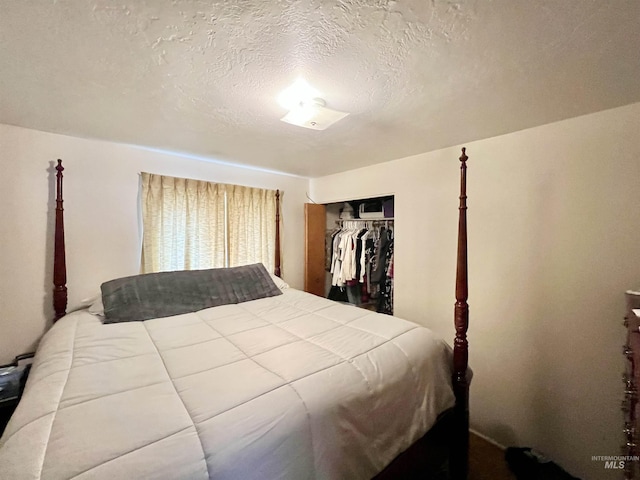 bedroom featuring a closet and a textured ceiling