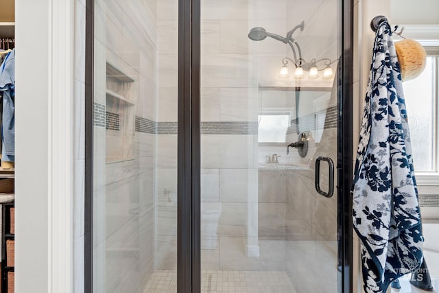 bathroom featuring a shower with door