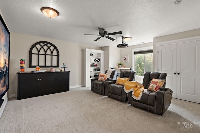 1175 N Champions Pl, Eagle, ID 83616 - living area featuring a textured ceiling, ceiling fan, light colored carpet, and baseboards