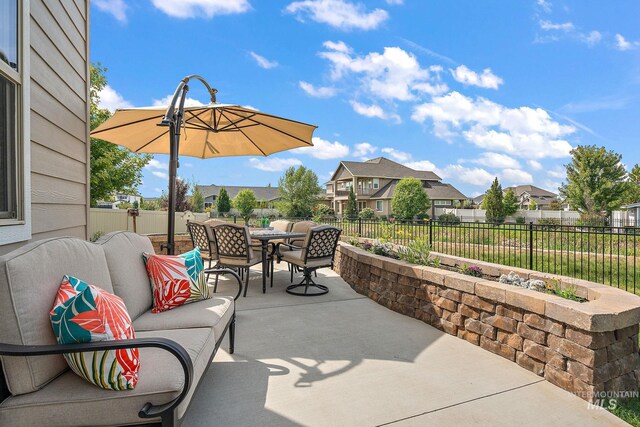 1175 N Champions Pl, Eagle, ID 83616 - view of patio / terrace featuring an outdoor living space, a fenced backyard, a residential view, and outdoor dining space