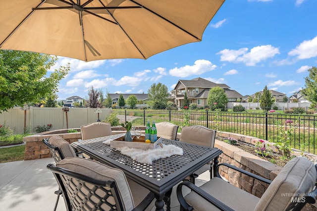 1175 N Champions Pl, Eagle, ID 83616 - view of patio / terrace featuring a residential view, outdoor dining area, and a fenced backyard