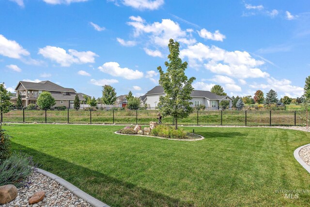 1175 N Champions Pl, Eagle, ID 83616 - view of yard featuring a fenced backyard and a residential view