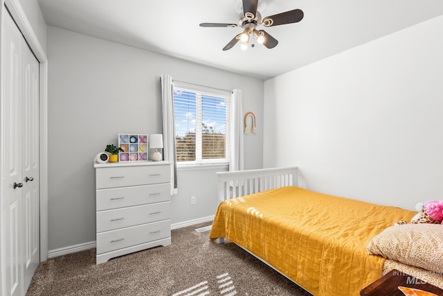 bedroom with a closet, carpet floors, baseboards, and ceiling fan