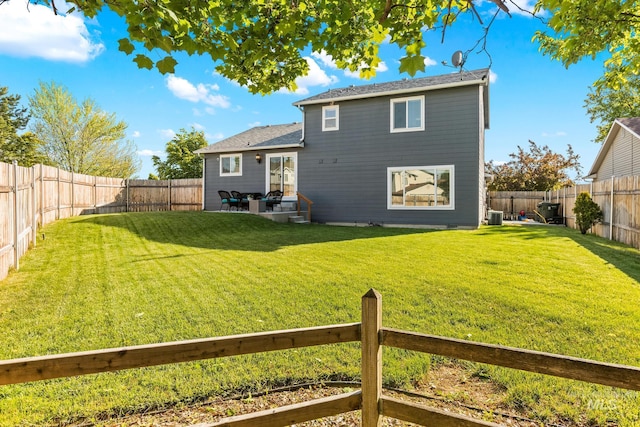 rear view of property featuring central AC unit and a patio