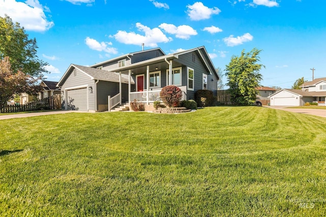 view of front facade featuring covered porch, an attached garage, and concrete driveway