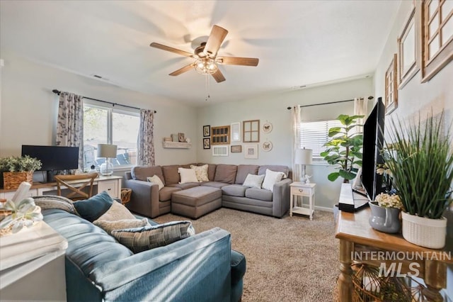 living room featuring ceiling fan and carpet flooring