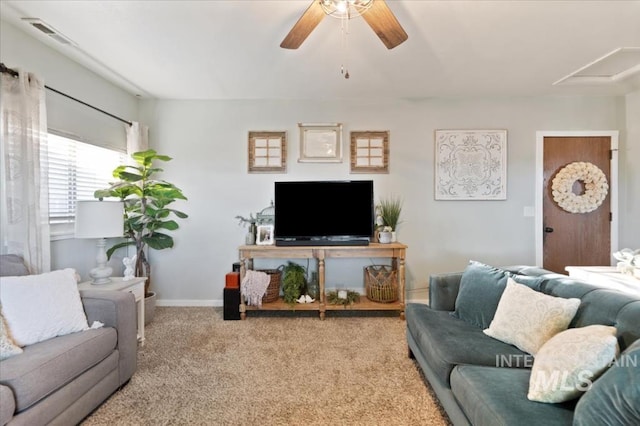 living room featuring a ceiling fan, carpet floors, and baseboards