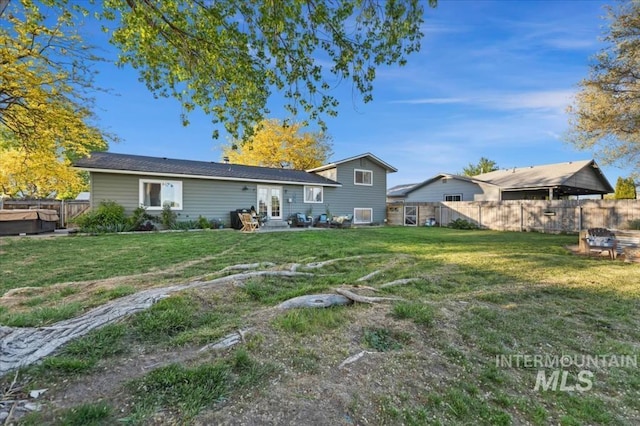 back of property with a patio