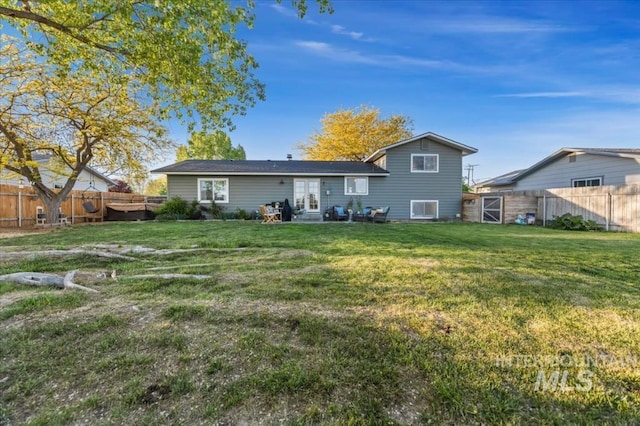 rear view of property featuring french doors