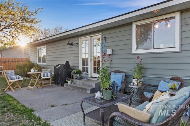 view of patio / terrace with fence and a grill