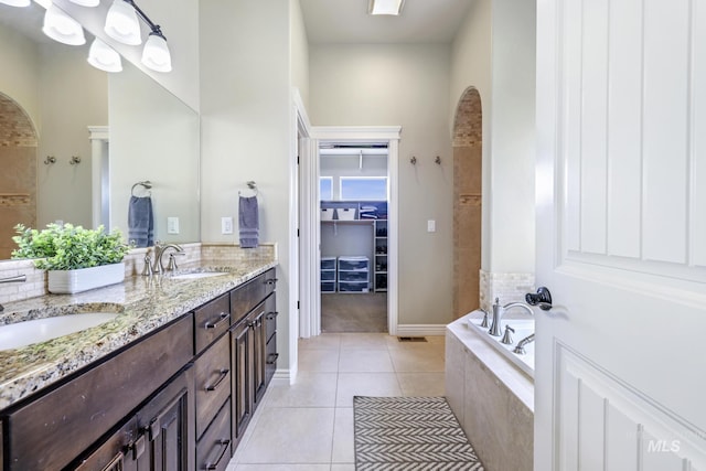 4049 Quail Ridge Dr, Kimberly, ID 83341 - full bathroom featuring tile patterned floors, double vanity, a sink, and a walk in closet