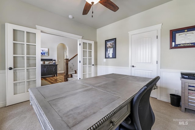 4049 Quail Ridge Dr, Kimberly, ID 83341 - carpeted office featuring arched walkways, wainscoting, french doors, and ceiling fan