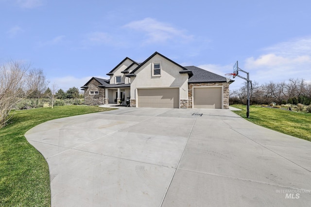 4049 Quail Ridge Dr, Kimberly, ID 83341 - view of front of house with stucco siding, driveway, stone siding, an attached garage, and a front lawn