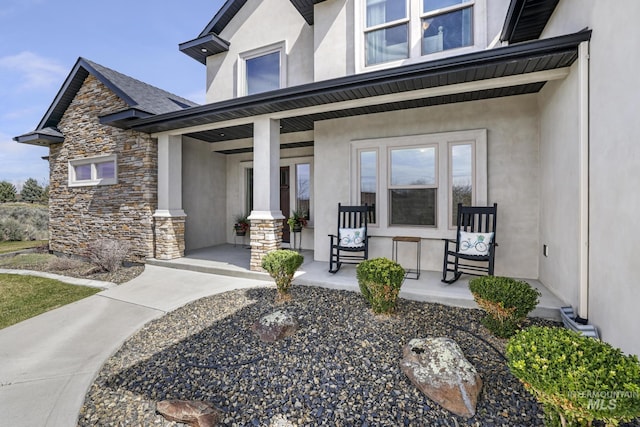 4049 Quail Ridge Dr, Kimberly, ID 83341 - entrance to property featuring a porch, stone siding, and stucco siding