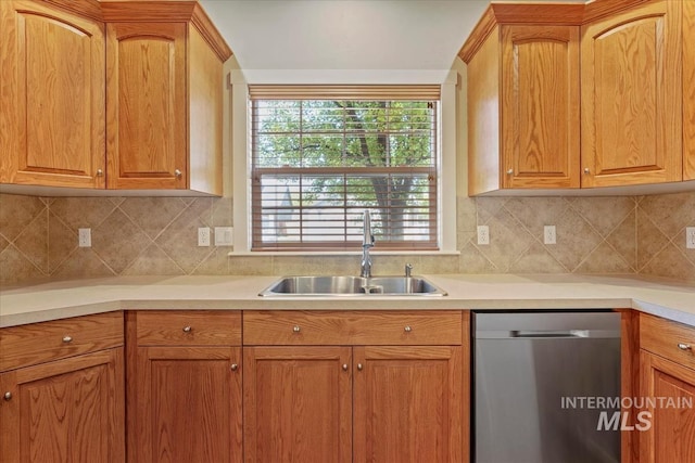 11871 W Wilmont St, Boise, ID 83709 - kitchen featuring dishwasher, a sink, light countertops, and brown cabinetry