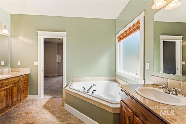 11871 W Wilmont St, Boise, ID 83709 - full bathroom with two vanities and a garden tub