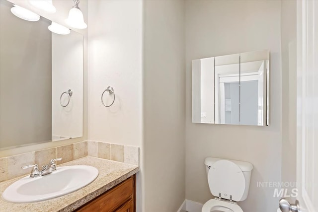 11871 W Wilmont St, Boise, ID 83709 - bathroom featuring vanity, toilet, and baseboards