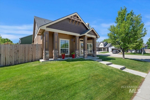 11871 W Wilmont St, Boise, ID 83709 - view of front facade featuring covered porch and a chimney