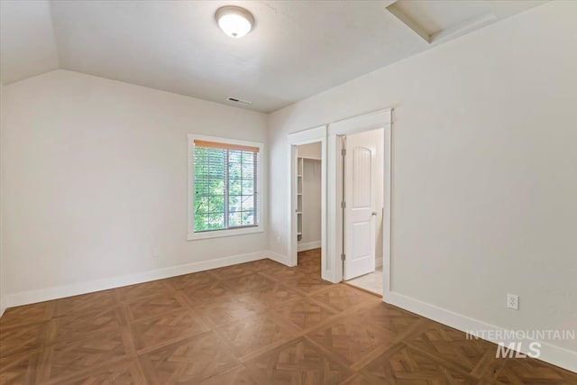 11871 W Wilmont St, Boise, ID 83709 - empty room featuring attic access, baseboards, and vaulted ceiling