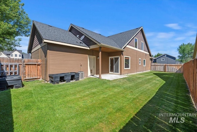 11871 W Wilmont St, Boise, ID 83709 - rear view of house with a shingled roof and a patio