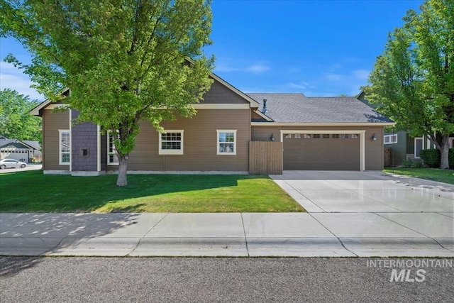 11871 W Wilmont St, Boise, ID 83709 - view of front facade featuring a garage, driveway, and a front lawn