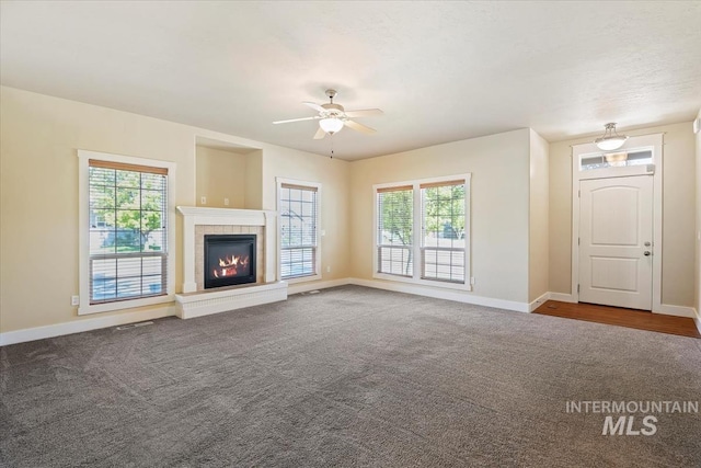11871 W Wilmont St, Boise, ID 83709 - unfurnished living room featuring carpet flooring, plenty of natural light, and baseboards
