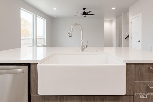 kitchen with ceiling fan, stainless steel dishwasher, and sink