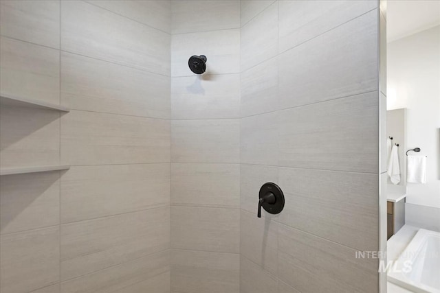 full bathroom featuring tiled shower