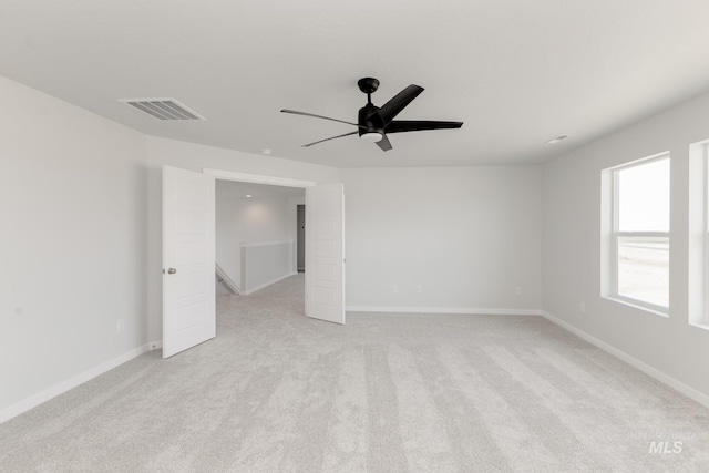 5375 S Memory Pl, Meridian, ID 83642 - spare room with light colored carpet, a ceiling fan, and baseboards