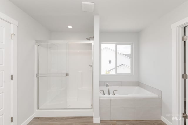 5375 S Memory Pl, Meridian, ID 83642 - full bathroom with wood finished floors, a bath, a shower stall, and recessed lighting