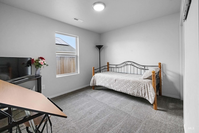 bedroom featuring baseboards, visible vents, and carpet floors