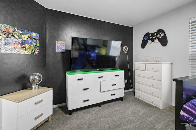 bedroom featuring baseboards and carpet flooring