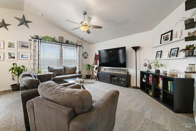 living room featuring high vaulted ceiling, a ceiling fan, and carpet