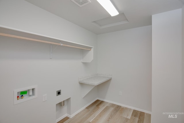 washroom featuring light wood finished floors, visible vents, washer hookup, hookup for an electric dryer, and laundry area