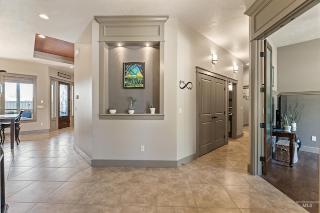 4763 S Skyridge Way, Boise, ID 83709 - hallway featuring baseboards, light tile patterned floors, a tray ceiling, and recessed lighting