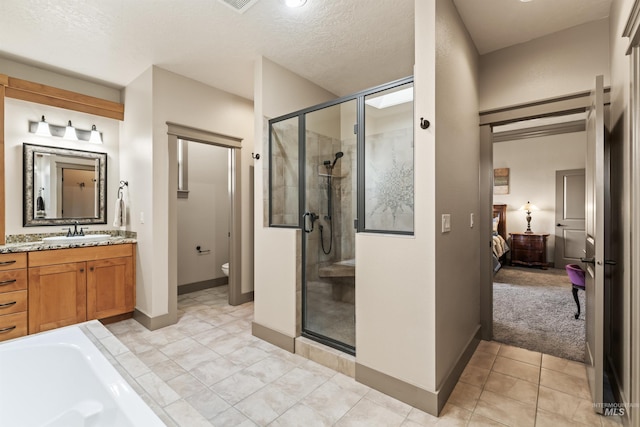 4763 S Skyridge Way, Boise, ID 83709 - bathroom featuring connected bathroom, a shower stall, vanity, toilet, and a textured ceiling